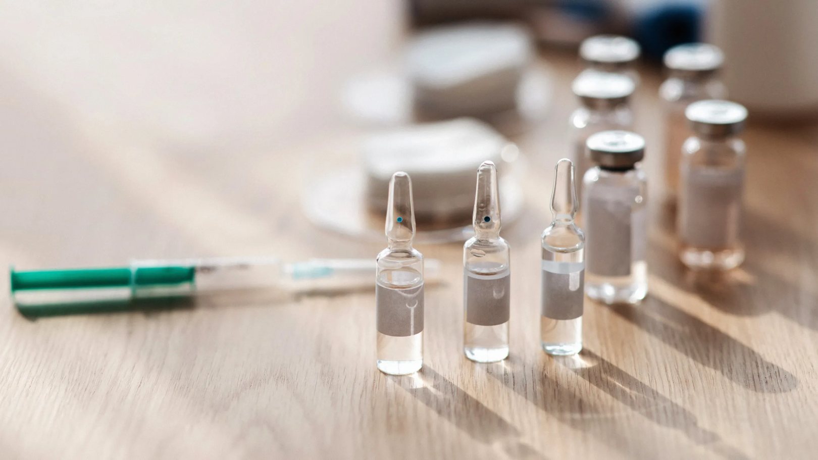Medicine pharmacy and health care vaccination and treatment. Ampoules with vaccine medicines syringe with needle cotton...